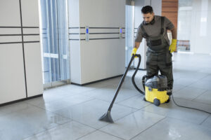 full-shot-man-vacuuming-office-floor