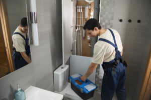 male-plumber-working-fix-problems-client-s-house